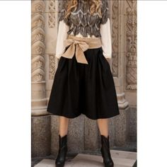 Heavier Weight Fabric With A Pleated Front And Classic Wide-Leg Gaucho Fit. Hidden Back Zipper With Attached Ribbon Belt And Side Pockets. 50 Wool, 50 Polyester Measurements (S): L: 29" W: 28" I.S.: 14" Chic Black Belted Wide Leg Pants, Black Belted High Waist Wide Leg Pants, Casual Belted Wide Leg Pants For Fall, High Waist Wide Leg Pants For Fall Day Out, Fall High Waist Wide Leg Pants For Day Out, Chic Winter Bottoms For Day Out, Fall Knee-length Pants With Pockets, Winter Bottoms With Pockets For Day Out, Winter Day Out Bottoms With Pockets