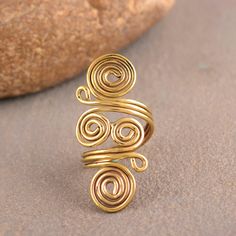 Spiral Brass Ring, Swirl Ring, Gold Wired Ring, Big Spiral Ring, Hypnotic Ring, Boho Ring, Wired Band, Spiral Band Handmade Dainty Ring Size :- All size are available METAL :- Brass ❥ Customers satisfaction is our biggest priority, please contact us with any questions/queries for future or existing orders, and we will do our best to make sure you are happy with your order. ♥ Please Make Sure to Include The Correct Address During Before Order. You Can return Item within 30 Days After Successful Delivery. We Offer 100% Money Back Guarantee If You Not Satisfied With Your Purchase. Return Charge Will Be Paid By Buyer Only. This is my shop link https://www.etsy.com/in-en/shop/AustereGifts?ref=seller-platform-mcnav Thank you🥰 for shopping with us! Handmade Wire Rings, Wired Ring, Jewelry Tutorials Free, Handmade Copper Bracelet, Gold Wire Ring, Diy Wire Jewelry Rings, Wire Jewelry Earrings, Wire Jewelry Rings, Medical Jewelry