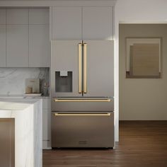 a large metallic refrigerator freezer sitting inside of a kitchen next to a counter top