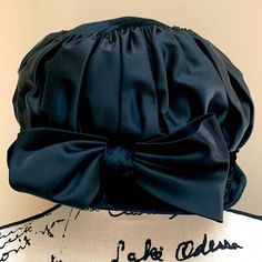 Gorgeous soft black brim and big bow!  Perfect for church, funerals, etc. no size.   Measures at a size 7. Black Bonnet With Curved Brim, One Size Fits Most, Black Bonnet One Size Curved Brim, Black Bonnet With Curved Brim, Black Brimmed Hat With Bow, Black Hat With Bow And Curved Brim, Kentucky Derby Black Hat With Bow, Black Evening Hat With Bow, Brimmed Black Cloche Hat For Church, Black Brimmed Cloche Hat For Church