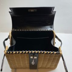 Elevate your style with the Willa Woven Black Straw Hand Bag, a timeless accessory that embodies effortless elegance and sophistication. Crafted for the modern woman, this exquisite bag promises to be your go-to companion, inspiring confidence and turning heads wherever you go. 11" x 3.5" x 9" Woven Rattan. Vegan leather trim Includes long strap Pair it with one of our Ashley acrylic convertible straps for a unique look! Designer Crossbody Box Bag With Adjustable Strap, Designer Box Bag With Adjustable Strap For Everyday Use, Designer Rectangular Straw Bag With Top Carry Handle, Designer Rectangular Satchel With Adjustable Strap, Designer Rectangular Box Bag With Adjustable Strap, Luxury Rectangular Straw Bag With Detachable Strap, Designer Black Rectangular Straw Bag, Designer Rectangular Shoulder Bag With Adjustable Strap, Designer Black Straw Bag For Daily Use