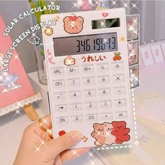 a calculator with an image of a teddy bear on the front and side