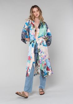 [Color: Ivory/Grey] A front facing image of a blonde model wearing a soft and silky bohemian lounge duster kimono robe in a multi color floral patchwork print. With half length kimono sleeves Bohemian Relaxed Fit Kimono For Daywear, Long Patterned Floral Print Kimono, Long Patterned Kimono With Floral Print, Multicolor Short Sleeve Kimono, Multicolor Patchwork Kimono For Vacation, Bohemian Spring Robe With Kimono Sleeves, Multicolor Patchwork Kimono For Spring, Multicolor Long Kimono With Boho Print, Bohemian Robe With Kimono Sleeves For Daywear