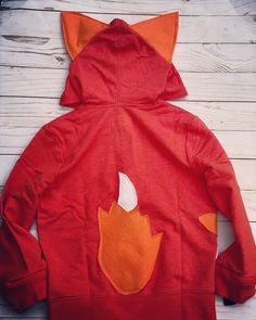 This fox hoodie has been a huge hit. Perfect for any fox lover . I recently took our fox pocket hoodie and this hoodie and combined them. You can choose if you want a fix in the pocket or not. Orange hoodie may vary in different shades. Each computer / screen / phone might show colors differently. Orange hoodies are a tough find so that is why sometimes I have to use different brands and they have a slight color difference. Wash inside out and lay or hang to dry. If dried in the dryer they loose Hooded Cotton Sweater With Kangaroo Pocket, Cotton Hooded Sweater With Kangaroo Pocket, Cute Hooded Hoodie For Fall, Cute Hooded Fall Sweater, Cute Hoodie With Drawstring Hood For Fall, Cute Winter Hoodie With Pockets, Cute Fall Hoodie With Drawstring Hood, Cute Hoodie With Pockets For Winter, Cute Cotton Hoodie With Kangaroo Pocket