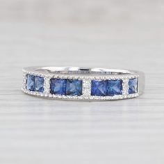 a white gold ring with blue sapphires and diamonds