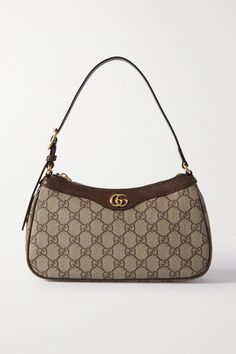 Gucci's bag is part of the 'Ophidia' collection, coveted for its timeless silhouettes. It's been crafted in Italy from printed coated-canvas, trimmed with textured-leather and embellished with the signature, gold-tone 'GG' motif. There's just enough room inside for a few essentials. Designer Bags Gucci, Purse Gucci, Fancy Purses, Dream Bags, Luxury Bags Collection, Mode Zara, Latest Handbags, Gucci Handbag, Handbag Essentials