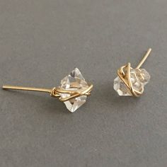 Two Herkimer diamonds are wire-wrapped with 14k Gold Fill, Rose Gold Fill, or Sterling Silver wire. Herkimer diamonds measure approximately 3/8 of an inch long. Item comes packaged in a jewelry box. YOUR ORDER - Choose either gold fill, rose gold fill, or sterling silver in the drop-down menu. - You can select expedited shipping at checkout. Please note that shipping time does NOT include production time. - Item comes packaged in a jewelry box. Gold Hand-wrapped Earrings For Gift, Gold Hand-wrapped Wrap Earrings As Gift, Gold Hand Wrapped Wrap Earrings As Gift, Gold Hand Wrapped Wrap Earrings For Gift, Studio City, Earrings In Gold, Herkimer Diamond, Everyday Earrings, Silver Wire