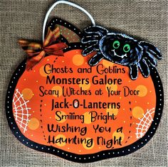 a wooden sign that says ghost and goslings monsters galore scary witches at your door