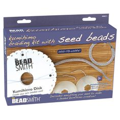 the packaging for seed smith's kit includes two white beads and a string that is attached