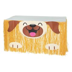 a cardboard dog with fringes on it's head and tongue sticking out from its mouth