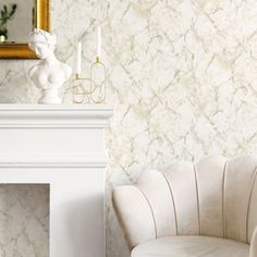 a white chair sitting in front of a fireplace next to a mirror on top of a wall