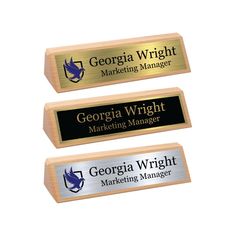 three wooden name tags with the words georgia wright marketing manager and george wright marketing manager