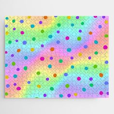 a rainbow colored background with lots of dots on it