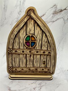 a wooden box with a stained glass window