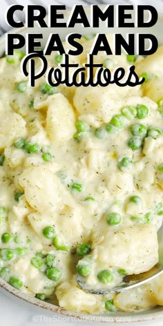 a bowl filled with peas and potatoes on top of a white plate next to a spoon