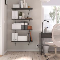 a room with some shelves and books on the wall