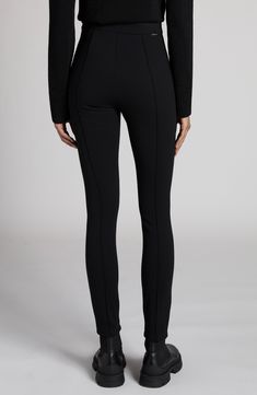 Striking a balance between athleisure and streetwear, these leggings made of a stretch-enhanced twill knit and finished with stitched pintucks deliver all-around, versatile style. Hidden side-zip closure 95% polyamide, 5% elastane Hand wash, dry flat Imported Designer Clothing Chic Stretch Bottoms With Seam Detailing, Modern Fitted Leggings For Fall, Fitted Modern Leggings For Fall, Athleisure Workwear Leggings, Sporty Leggings For Workwear In Fall, Athleisure Leggings For Workwear, Tight Fit, Athleisure Tight Leggings For Workwear, Fitted High-waisted Leggings, Fitted High-waisted Pull-on Leggings