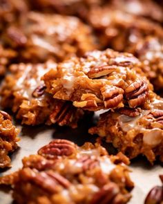 several cookies with pecans and icing on top