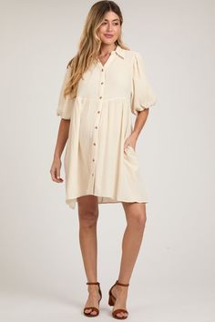 Cream Button Down Bubble Sleeve Collared Maternity Dress Short Sleeve Day Dresses With Buttoned Pockets, Short Sleeve Daywear Dresses With Buttoned Pockets, Short Sleeve Dresses With Buttoned Pockets For Daywear, Short Sleeve Nursing Friendly Day Dress, Nursing Friendly Short Sleeve Daywear Dresses, Daywear Nursing Friendly Dress With Short Sleeves, Nursing Friendly Short Sleeve Dresses For Daywear, Bump Friendly Maternity Dress With Short Sleeves, Fitted Bump Friendly Maternity Dress With Short Sleeves