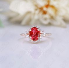 Lab created ruby ring. The design can be made with other gemstones as well. If you would prefer a custom ring, please contact us before purchase. SKU:RG8780 Details Main stone:lab created ruby, 8X6mm Material: 925/14k/18k  Sizes available: 4-12 (Larger and smaller sizes are available as well. Priced upon request.) Side accents: moissanite Procedure information Please select the ring size and material from the drop-down menu. If you have any special requests or questions, please do not hesitate to contact us. Anniversary Rose Gold Ruby Ring With Lab-created Ruby, Anniversary Rose Gold Lab-created Ruby Ring, Anniversary Rose Gold Ruby Ring, Rose Gold Ruby Ring With Halo Setting For Anniversary, Rose Gold Ruby Ring With Halo Setting As Gift, Rose Gold Ruby Ring With Halo Setting, Gift Lab-created Ruby Birthstone Ring With Halo Setting, Gift Birthstone Ring With Halo Setting And Lab-created Ruby, Birthday Ring