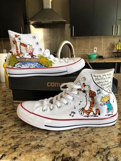 Custom Painted Converse shoes INSPIRED by characters resembling Calvin and Hobbes. These shoes are in no way claiming to be a true representation of Bill Waterson's characters Calvin and Hobbes. My shoes are painted with a high quality acrylic paint and sprayed with a UV protectant. Custom requests are welcomed! All shoes are made to order. Custom Painted Converse, Painted Converse, My Shoes, Calvin And Hobbes, Custom Painted, Cute Woman, Custom Paint, Converse Shoes, Converse Chuck Taylor High Top Sneaker