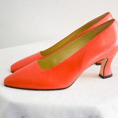 "Vintage 1990s red-orange leather heels. Made by Nine West. Marked a size 7 1/2 M. The soles are man-made. The heels are 3\" tall, and they measure 10\" long inside from toe to heel and 2.75\" wide inside. In great condition, with very little wear.  ---> If you need an order shipped by a particular date or shipped via a quicker method, please ask PRIOR to purchase to see if we can accommodate that request. Visit the rest of our shop for more goodies ---> https://www.etsy.com/shop/BlackbirdAntiquesNC Visit our shop policies page for sizing info, shipping guidelines, and more ---> https://www.etsy.com/shop/BlackbirdAntiquesNC/policy Find us on Instagram @blackbirdantiquesnc or Facebook ---> https://www.facebook.com/blackbirdgirlsvintage or Pinterest ---> https://www.pinterest.com/4and20/" Sewing Tape Measure, Womens Pumps, One Photo, Orange Leather, Modern Outfits, Three Days, Tape Measure, First Photo, Womens Heels