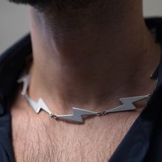 We're proud to present the Bolt Lightning Flash necklace, a very trendy and fashion piece of jewelry. Featuring a recurring bolt symbol, this necklace was made not to be unnoticed, especially for party, clubbing or a fashion night out. It is made of durable, hipoallergenic stainless steel and it's 50cm long - extendible to 55-58cm thanks to its very nice clousure. The necklace might be too edgy for everyday use, but it surely will stand out on a special occasion. -- Shipping info --- - Complimen Flash Necklace, Necklace For Him, Club Jewelry, Lightning Flash, Trendy Necklace, Trendy Necklaces, Jewel Box, Fashion Night, Ring Sizer