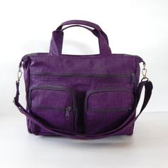 *** Please check 'shop announcement' for production time and delivery before your purchase. ***This all purpose bag is made from deep plum water resistant nylon, a sturdy and durable material. It is big enough to hold lots of your everyday essentials, laptop and books. You can use it as a messenger bag and also a diaper bag, a travel bag or a school bag. You can order this bag slightly BIGGER or SMALLER, please just let me know.The detachable strap is adjustable from 27" to 47" which you can wea Large Capacity Purple Nylon Bag, Multifunctional Purple School Bag, Purple Multifunctional Bag For Daily Use, Multifunctional Purple Bag For Daily Use, Functional Purple Travel Shoulder Bag, Functional Purple Shoulder Bag For Travel, Rectangular Purple Duffle Bag For Everyday Use, Purple Travel Shoulder Bag With Zipper Pocket, Rectangular Weekender Bag With Adjustable Strap For School