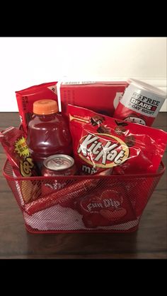 a red basket filled with snacks and condiments