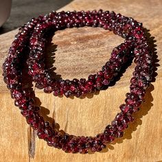 Red Garnet Endless Necklace . Approximately 25-26 inches . NO CLASP SLIP ON STYLE .                                                                             📌 Science & Origin : This Beautiful crystal was hand picked to show unique patterns. Beautifully shaped to facilitate meditation. These beautiful GARNET would be the perfect addition to anyone's home decor, crystal grid, or crystal collection!   📌 You will receive : 1 Pictured Crystal  *You will get the same one that is in the picture. Jewellery Shop Design, Gemstone List, Fancy Lights, Garnet Jewelry, Crystal Grid, Gems Jewelry, Crystal Collection, Faceted Gemstones, Red Garnet