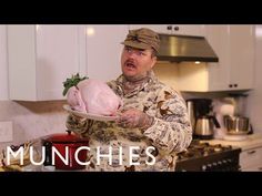 a man in uniform holding a turkey on top of a plate with the words munchies over it