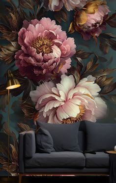 a living room scene with focus on the couch and wallpaper that has flowers painted on it