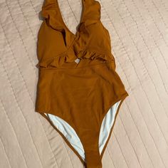 Nwt Cupshe Women’s One Piece Tie Neck Swimsuit. Burnt Orange Sz M. Ribbed Material. Perfect Condition. No Rips, Stains Or Odors. Brown V-neck Swimwear For The Beach, Orange One-piece Bodysuit For Pool, Orange One-piece Bodysuit For Beach, Orange One-piece Bodysuit For Beach Season, Orange Stretch One Piece For Poolside, Orange Stretch One Pieces For Poolside, Orange Beach Bodysuit, Orange Bodysuit For Poolside And Beach Season, Orange Stretch One-piece For Poolside