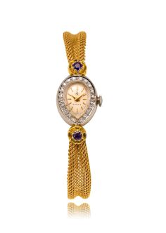 This fabulous and feminine BIRKS Swiss-made dress watch exudes confident luxury, crafted with a pear-shaped bezel of bright 14kt white gold. The dial is a silvery champagne colour, with yellow gold-coloured stick-hour markers and hands. The dial is shimmeringly set all around with 20 diamonds (0.20 total carat weight, S1 clarity, H-I colour), whilst the lugs are set with deeply coloured, beautiful natural sapphires (0.28 total carat weight) in floral settings. The watch is attached to a 14kt yel Luxury Yellow Gold Sapphire Jewelry, Champagne Colour, Made Dress, Amazing Watches, Champagne Color, Dress Watch, Natural Sapphire, Swiss Made, Link Bracelets