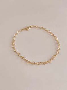 Handmade Heart of Gold Bracelet 🤍✨ 18 Karat Gold Filled Heart Chain Bracelet  Handmade to your exact wrist size, please indicate your wrist size in the notes section at checkout.  Choose from small (2.3mm) or large (3.2mm) size heart chain.  All 18 karat gold filled metal is hypoallergenic, nickel free, and lead free.  Handmade ethically in my home studio in Brookings, South Dakota.  Each piece is packaged in my Mandy Ellen Designs gift packaging with a polishing cloth included. Delicate Bracelets For Valentine's Day, Dainty Heart Bracelet With Adjustable Chain For Wedding, Dainty Heart Charm Bracelet As Gift For Her, Dainty Heart Bracelet With Adjustable Chain For Mother's Day, Heart Shaped Chain Charm Bracelet Gift, Dainty Heart Bracelet With Adjustable Chain As Gift, Delicate Heart Bracelet With Delicate Chain, Dainty Bracelets With Adjustable Chain For Valentine's Day, Dainty Heart Beads Charm Bracelet For Valentine's Day