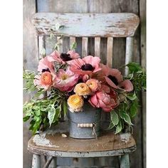 an old chair with flowers in it and the caption reads, i'm not sure what this is