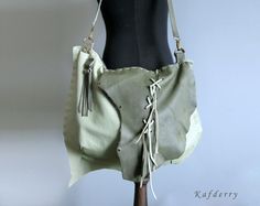 This bohemian bag is made of genuine  leather in light and dark olive green tones. I use fringe details.  There are 2 pockets inside and one of them is zippered. All sewings are handmade  carefully.  Its  width is 44 and height is 32 cm. Thickness is 8 cm. (17'' x12,5'' x 3'' ) Please note that color may vary according to monitor color calibrations. If you have any question, please don't hesitate me to ask whatever you want know. Bohemian Bag, Leather Fringe Bag, Bohemian Bags, Fringe Bags, Dark Olive Green, Green Tones, Green Leather, Bag Shoulder, Large Bags