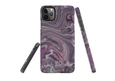 the purple marble phone case is next to a pen