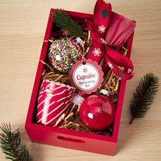 a red box filled with assorted christmas ornaments