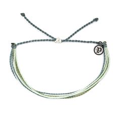 Be a green queen in this Earth Day mixed Original bracelet. This super-stackable style features strings in soft blue, green and white shades and packs an eco-chic punch. For each bracelet sold, Pura Vida will donate 5% of the purchase price to the National Parks Conservation Association, helping to fund its mission to protect and preserve Americas national parks for present and future generations. | Pura Vida Original string bracelet in Earth Day design. | Wax-coated polyester string cord with m