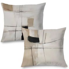 two pillows with black and white designs on them