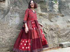 Red dress in an easy to wear Madame Hall design from hand printed, 100% cotton. It blends an international vibe with the Indian charm of superb Ajrakh block prints! The art wear vibe is unmistakable in a pattern mix of stunning fabrics, all  printed by hand with natural dyes. This dress will satisfy women who love artistry, and love India's hand handmade textiles.  It combines Ajrakh prints by one of Indias's celebrated textile artists in a Madame Hall design that'll adapt to the seasons. It'll  look just as great layered worn with boots, as it does on a sunny summer's day. I've designed this dress with a simple V neck bodice, and let loose pattern magic in the full tiered skirt. The pattern contrasts of gorgeous florals, polka dots and abstract are all stunning prints. They create magic i Red Cotton Block Print Dress, Red Cotton Dresses With Printed Motifs, Red Cotton Dress With Bandhani Print, Red Cotton Batik Print Dresses, Red Cotton Dress With Batik Print, Red Cotton Anarkali Dress, Red Anarkali Dress With Bandhani Print, Red Cotton Maxi Dress With Block Print, Red Bohemian Dress With Kalamkari Print