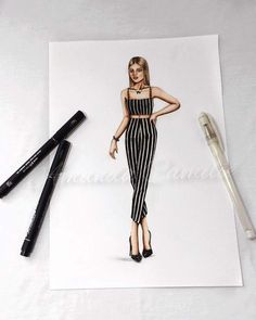 a drawing of a woman in black and white striped overalls next to some pens