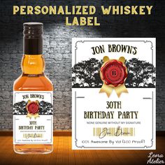 personalized whiskey label for 30th birthday party with bottle and gift card on wooden table