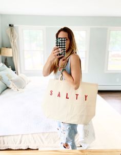 "The SALTY Oversized canvas tote bag is perfect for a trip to the beach! Also perfect to use as a reusable shopping bag, or everyday carryall. Available with text in several colors... check out the variations! This bag is made from 100% thick, sturdy canvas. AVAILABLE IN TWO SIZES * Large - 19.5\" x 13\" with a 4\" gusset *Jumbo - 23\" x 13\" with a 6\" gusset These bags are hand painted using non-toxic fabric paint. The technique used creates an attractive distressed appearance to the text that Summer Canvas Bag With Large Capacity, Summer Large Capacity Cotton Canvas Bag, Large Capacity Cotton Bag For Beach Season, Summer Large Capacity Cotton Beach Bag, Large Capacity Cotton Beach Bag For Summer, Cotton Tote Beach Bag For Beach Season, Cotton Beach Tote Bag For Beach Season, Cotton Canvas Bag For Daily Use And Beach Season, Beachy Cotton Rectangular Beach Bag