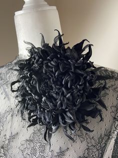 a dress with black flowers on the back