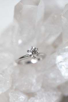 a diamond ring sitting on top of ice crystals