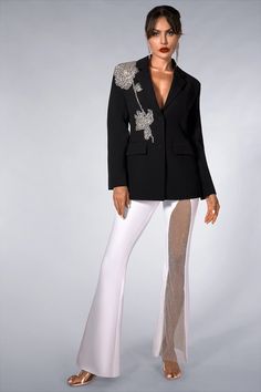 Elegant black blazer adorned with heavy-duty rhinestones-studded 3D floral motifs. Elevate your charm and style for special events, formal occasions, and fashion-forward gatherings. Handmade customization Fabric composition: 90% polyester fiber, 10% spandex Washing method: hand wash or dry clean Popular elements: floral Elegant Embellished Evening Blazer, Elegant Evening Embellished Blazer, Glamorous Party Blazer With Rhinestones, Elegant Fitted Blazer With Rhinestones, Elegant Evening Blazer With Rhinestones, Spring Glamorous Embellished Blazer, Elegant Party Blazer With Rhinestones, Elegant Rhinestone Blazer For Party, Fitted Party Blazer With Rhinestones