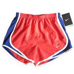 Red Stretch Athletic Shorts For Spring, Red Athletic Shorts For Spring, Nike Red Athletic Shorts, Nike Red Sporty Athletic Shorts, Nike Sporty Red Athletic Shorts, Nike Red Sporty Shorts, Sporty Red Athletic Shorts For Spring, Nike Red Bottoms With Built-in Shorts, Nike Sports Shorts In Red