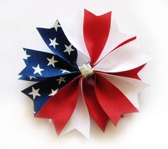 a red, white and blue pinwheel with stars on it's center is shown